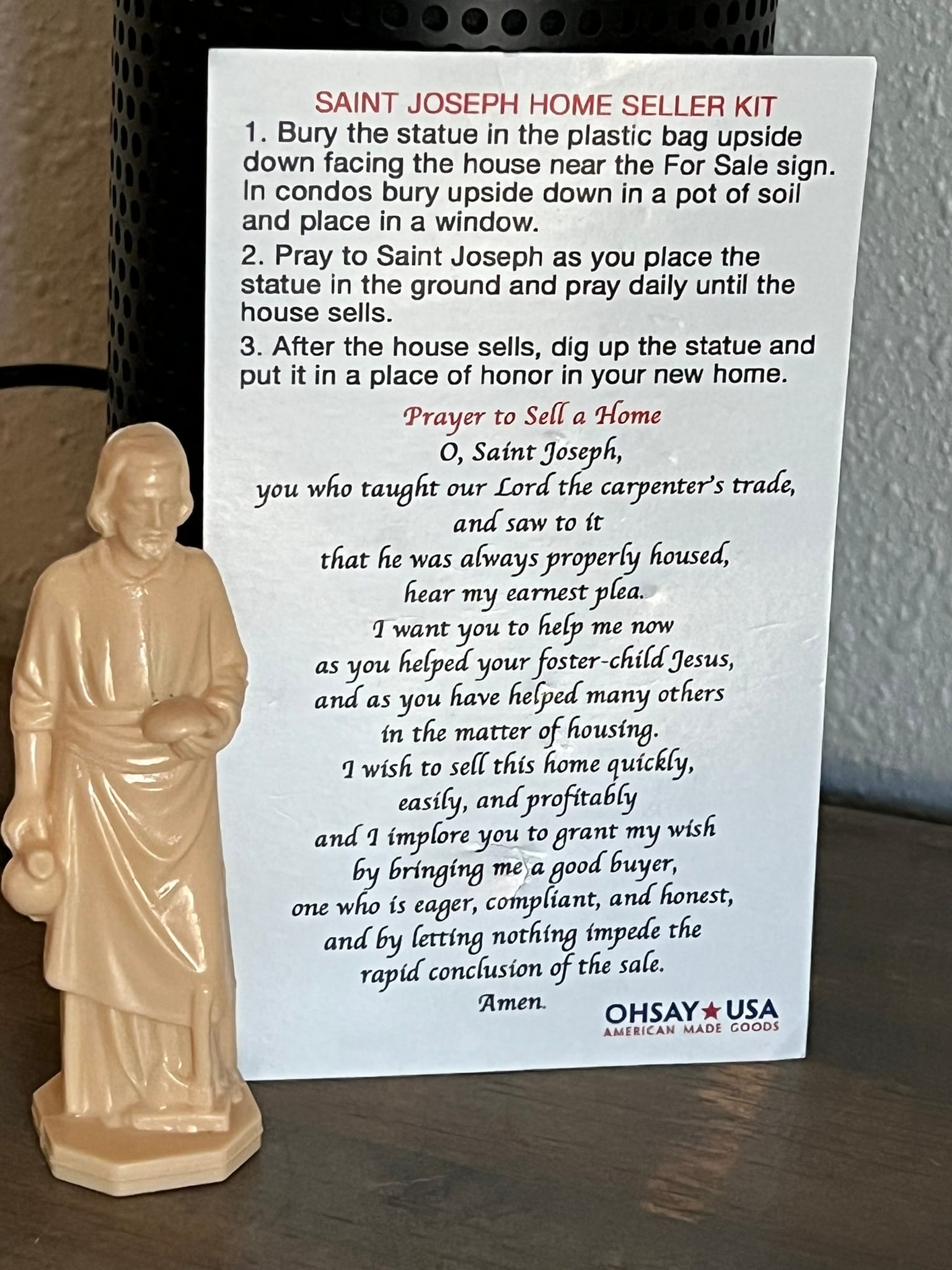 St. Joseph statue after being dug up from yard following successful house sale
