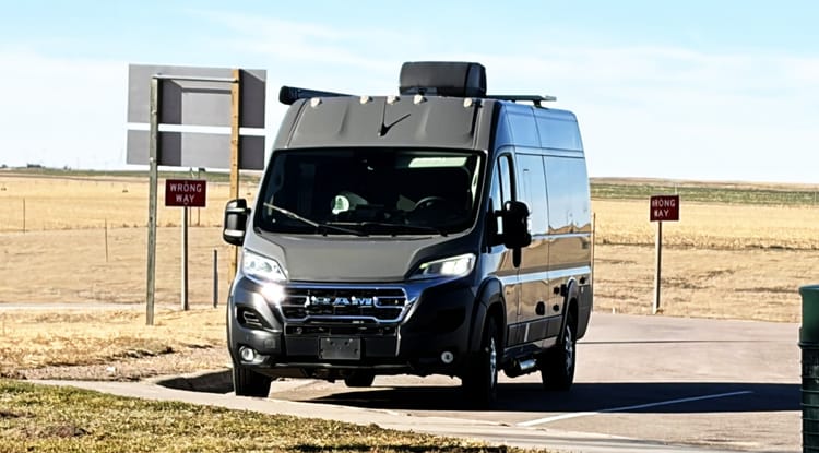 Camper van parked during a road trip that marked the first test drive of our new, downsized life