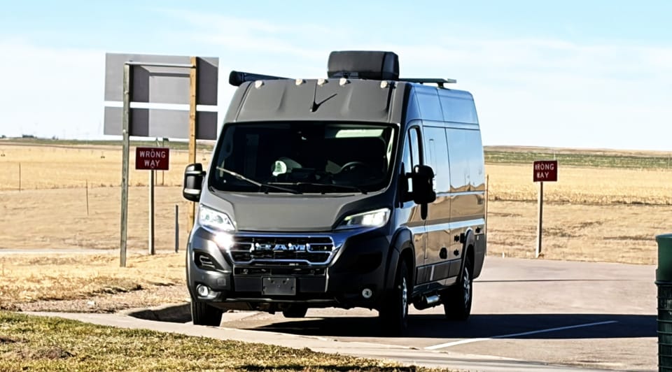 Camper van parked during a road trip that marked the first test drive of our new, downsized life
